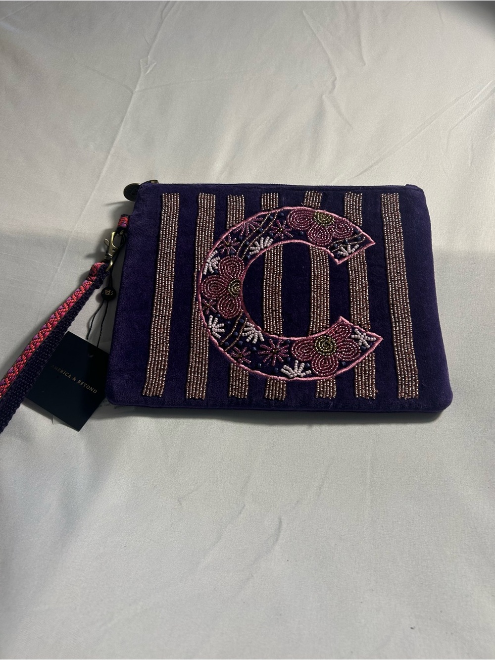 AMERICA &BEYOND Beaded Dark Purple C Wristlet with Pink Bead Accents